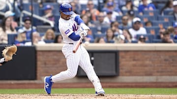 Jun 1, 2025; New York City, New York, USA; New York Mets shortstop Francisco Lindor (12) hits a home run against the Colorado Rockies during the fifth inning at Citi Field. Mandatory Credit: Gregory Fisher-Imagn Images