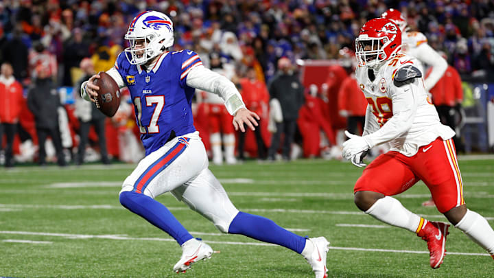 Buffalo Bills quarterback Josh Allen (17) sprints away from Kansas City Chiefs defensive end Neil Farrell (92) for some of his 72 yards.