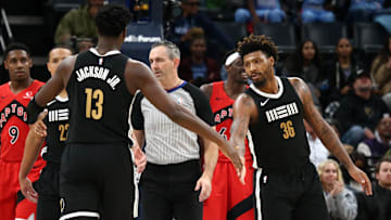 Jan 3, 2024; Memphis, Tennessee, USA; Memphis Grizzlies guard Marcus Smart (36) reacts with Memphis Grizzlies forward-center Jaren Jackson Jr. (13) during the second half against the Toronto Raptors at FedExForum. Mandatory Credit: Petre Thomas-Imagn Images