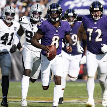 Baltimore Ravens quarterback Lamar Jackson (8) runs during the second half against the Las Vegas Raiders at M&T Bank Stadium. 