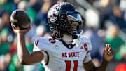Oct 11, 2025; South Bend, Indiana, USA; NC State Wolfpack quarterback CJ Bailey (11) throws a pass against the Notre Dame Fighting Irish during the first half at Notre Dame Stadium. Mandatory Credit: Michael Caterina-Imagn Images