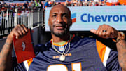 Nov 17, 2024; Denver, Colorado, USA; Retired American football player Aqib Talib during the second quarter between the Atlanta Falcons against the Denver Broncos at Empower Field at Mile High.