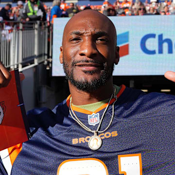 Nov 17, 2024; Denver, Colorado, USA; Retired American football player Aqib Talib during the second quarter between the Atlanta Falcons against the Denver Broncos at Empower Field at Mile High.