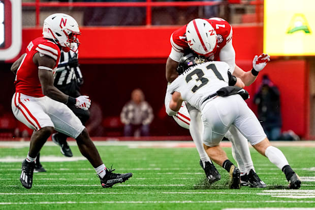 Nebraska Cornhuskers quarterback Jeff Sims (7) is tackled by Purdue Boilermakers defensive back Dillon Thieneman (31).
