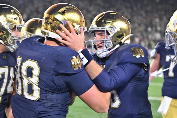 Notre Dame Fighting Irish tight end Mitchell Evans (88) celebrates with quarterback Riley Leonard (13) after a touchdown. Notre Dame Fighting Irish tight end Mitchell Evans (88) celebrates with quarterback Riley Leonard (13) after a touchdown.