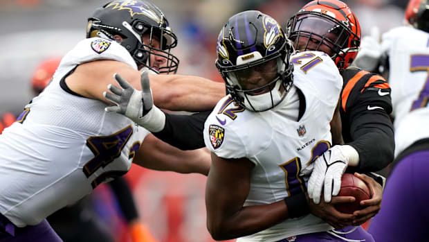 Jan 8, 2023; Cincinnati, Ohio, USA; Cincinnati Bengals defensive end Joseph Ossai (58) pressures Baltimore Ravens quarterback