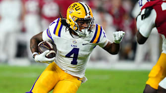 Nov 4, 2023; Tuscaloosa, Alabama, USA; LSU Tigers running back John Emery Jr. (4) carries the ball against the Alabama Crimson Tide during the second quarter at Bryant-Denny Stadium. Mandatory Credit: John David Mercer-Imagn Images