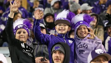 Nov 23, 2024; Manhattan, Kansas, USA; Kansas State Wildcats fans celebrate a win against the Cincinnati Bearcats at Bill Snyder Family Football Stadium. Mandatory Credit: Scott Sewell-Imagn Images