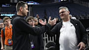 Mar 26, 2025; San Francisco, CA, USA; Florida Gators head coach Todd Golden (left) shakes hands with Stanford Cardinal men’s basketball head coach Kyle Smith (right) during NCAA Tournament West Regional Practice at Chase Center. Mandatory Credit: Eakin Howard-Imagn Images