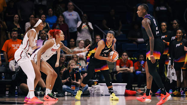 Alyssa Thomas holding the ball