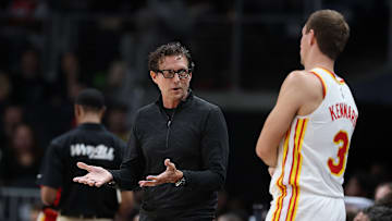 Hawks Head Coach Quin Snyder talks to Luke Kennard (3) during a game against the Houston Rockets. 