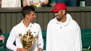 Novak Djokovic holds the 2022 Wimbledon trophy after beating Nick Kyrgios.