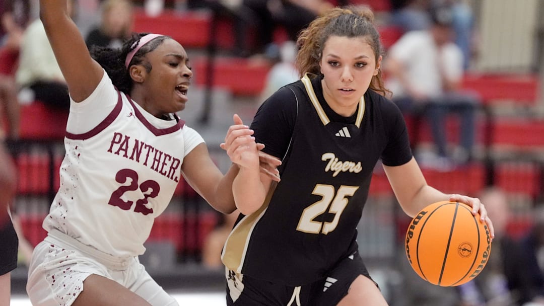 Broken Arrow's Mckenzie Mathurin drives to the basket as Putnam City North's Nate Muriithi defends during the Class 6A girls Oklahoma state basketball championship semifinal tournament game between Putnam City North and Broken Arrow at Yukon High School in Yukon, Okla., Friday, March, 14, 2025.