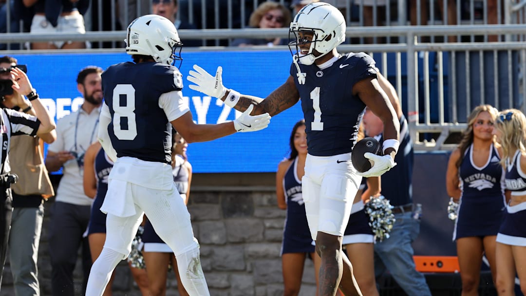 Aug 30, 2025; University Park, Pennsylvania, USA; Penn State Nittany Lions wide receiver Kyron Hudson (1) celebrates with wide receiver Trebor Peña (8) after scoring a touchdown during the second quarter against the Nevada Wolf Pack at Beaver Stadium. Mandatory Credit: Matthew O'Haren-Imagn Images