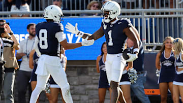 Aug 30, 2025; University Park, Pennsylvania, USA; Penn State Nittany Lions wide receiver Kyron Hudson (1) celebrates with wide receiver Trebor Peña (8) after scoring a touchdown during the second quarter against the Nevada Wolf Pack at Beaver Stadium. Mandatory Credit: Matthew O'Haren-Imagn Images