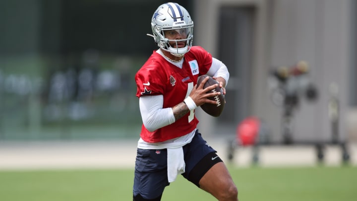 Jun 4, 2024; Frisco, TX, USA;  Dallas Cowboys quarterback Dak Prescott (4) goes through a drill during practice at the Ford Center at the Star Training Facility in Frisco, Texas. Mandatory Credit: Tim Heitman-USA TODAY Sports