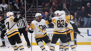 Jan 29, 2025; Salt Lake City, Utah, USA; Pittsburgh Penguins center Sidney Crosby (87) celebrates with teammates after scoring the winning goal against the Utah Hockey Club during overtime at Delta Center. Mandatory Credit: Rob Gray-Imagn Images