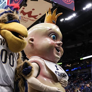 Jan 24, 2022; New Orleans, Louisiana, USA; Pierre T Pelican and King Cake Baby shoot t-shirts to fans on a time out between the New Orleans Pelicans and the Indiana Pacers game during the second half at the Smoothie King Center. 