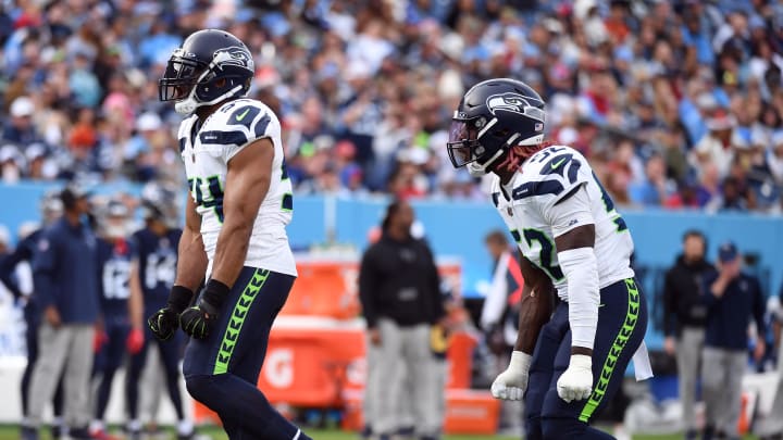 Dec 24, 2023; Nashville, Tennessee, USA; Seattle Seahawks linebacker Bobby Wagner (54) and linebacker Darrell Taylor (52) celebrate after a sack during the second half against the Tennessee Titans at Nissan Stadium. Mandatory Credit: Christopher Hanewinckel-USA TODAY Sports