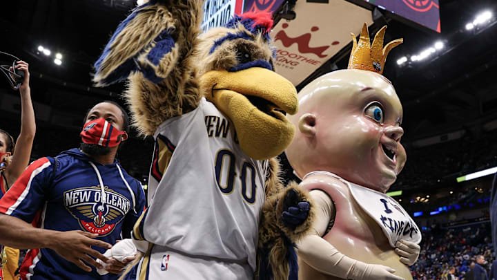 Jan 24, 2022; New Orleans, Louisiana, USA; Pierre T Pelican and King Cake Baby shoot t-shirts to fans on a time out between the New Orleans Pelicans and the Indiana Pacers game during the second half at the Smoothie King Center. 