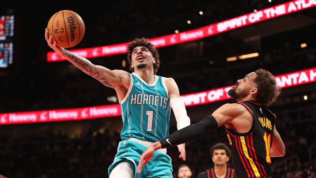 Mar 12, 2025; Atlanta, Georgia, USA; Charlotte Hornets guard LaMelo Ball (1) shoots against Atlanta Hawks guard Trae Young (11) during the second half at State Farm Arena. Mandatory Credit: Mady Mertens-Imagn Images Mar 12, 2025; Atlanta, Georgia, USA; Charlotte Hornets guard LaMelo Ball (1) shoots against Atlanta Hawks guard Trae Young (11) during the second half at State Farm Arena. Mandatory Credit: Mady Mertens-Imagn Images