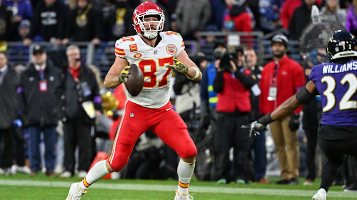 Jan 28, 2024; Baltimore, Maryland, USA; Kansas City Chiefs tight end Travis Kelce (87) looks to pass the ball against the Baltimore Ravens during the second half in the AFC Championship football game at M&T Bank Stadium. Mandatory Credit: Tommy Gilligan-Imagn Images