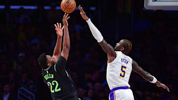 Nov 30, 2025; Los Angeles, California, USA; New Orleans Pelicans center Derik Queen (22) shoots against Los Angeles Lakers center Deandre Ayton (5) during the first half at Crypto.com Arena. Mandatory Credit: Gary A. Vasquez-Imagn Images