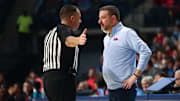 Jan 4, 2025; Oxford, Mississippi, USA; Mississippi Rebels head coach Chris Beard talks with an official during the first half against the Georgia Bulldogs at The Sandy and John Black Pavilion at Ole Miss. Mandatory Credit: Petre Thomas-Imagn Images