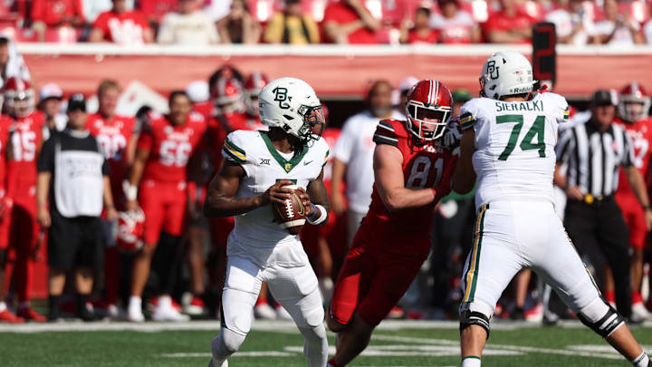 Sep 7, 2024; Salt Lake City, Utah, USA; Baylor Bears quarterback Dequan Finn (7) drops back to pass against the Utah Utes during the fourth quarter at Rice-Eccles Stadium. Mandatory Credit: Rob Gray-Imagn Images