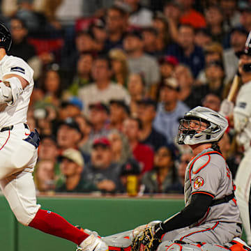 Sep 9, 2024; Boston, Massachusetts, USA; Boston Red Sox designated hitter Tyler O'Neill (17) hits a home run against the Baltimore Orioles in the third inning at Fenway Park. Mandatory Credit: David Butler II-Imagn Images