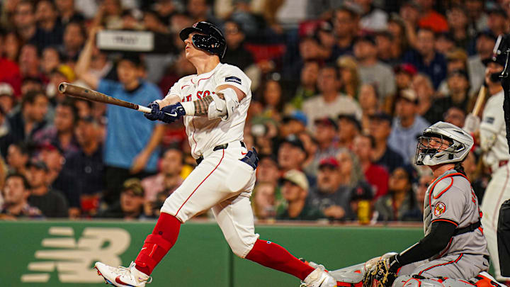 Sep 9, 2024; Boston, Massachusetts, USA; Boston Red Sox designated hitter Tyler O'Neill (17) hits a home run against the Baltimore Orioles in the third inning at Fenway Park. Mandatory Credit: David Butler II-Imagn Images