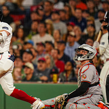 Sep 9, 2024; Boston, Massachusetts, USA; Boston Red Sox designated hitter Tyler O'Neill (17) hits a home run against the Baltimore Orioles in the third inning at Fenway Park.