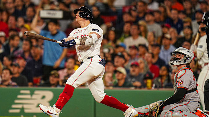 Sep 9, 2024; Boston, Massachusetts, USA; Boston Red Sox designated hitter Tyler O'Neill (17) hits a home run against the Baltimore Orioles in the third inning at Fenway Park.