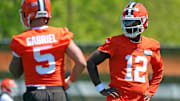 Cleveland Browns quarterback Shedeur Sanders watches quarterback Dillon Gabriel during NFL rookie minicamp.