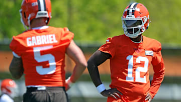 Cleveland Browns quarterback Shedeur Sanders watches quarterback Dillon Gabriel during NFL rookie minicamp.