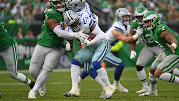 Dec 29, 2024; Philadelphia, Pennsylvania, USA; Philadelphia Eagles defensive tackle Jalen Carter (98) triers to stop Dallas Cowboys running back Rico Dowdle (23) during the third quarter at Lincoln Financial Field. Mandatory Credit: Eric Hartline-Imagn Images