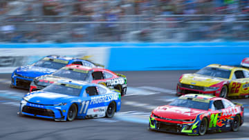 Nov 2, 2025; Avondale, Arizona, USA; NASCAR Cup Series driver Denny Hamlin (11) drives ahead of driver Chase Briscoe (19) driver Kyle Larson (5) and driver William Byron (24) during the Cup Series Championship race at Phoenix Raceway.