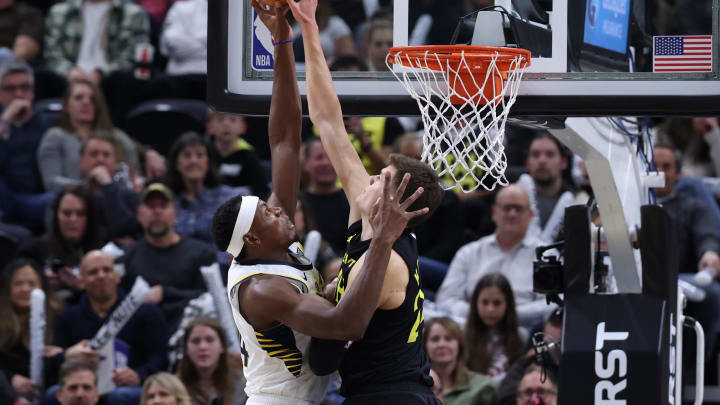 Jan 15, 2024; Salt Lake City, Utah, USA; Indiana Pacers center Oscar Tshiebwe (44) has his shot blocked by Utah Jazz center Walker Kessler (24) during the fourth quarter at Delta Center. Mandatory Credit: Rob Gray-USA TODAY Sports