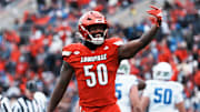 Louisville Cardinals defensive lineman Clev Lubin (50) celebrates his sack of Kentucky Wildcats quarterback Cutter Boley (8) in the first half Saturday, November 29, 2025 in Louisville, Kentucky at L&N Federal Credit Union Stadium.