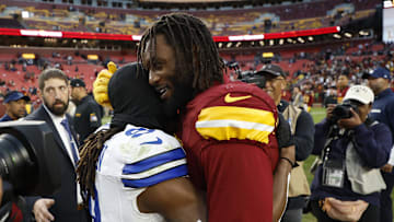 Nov 24, 2024; Landover, Maryland, USA; Dallas Cowboys wide receiver KaVontae Turpin (9) hugs Washington Commanders linebacker Dante Fowler Jr. (6) after their game at Northwest Stadium. Mandatory Credit: Geoff Burke-Imagn Images
