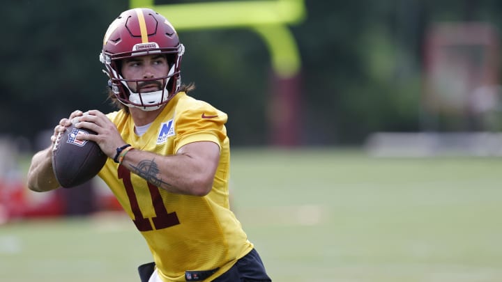 Jul 25, 2024; Ashburn, VA, USA; Washington Commanders quarterback Sam Hartman (11) prepares to pass the ball during day two of Commanders training camp at OrthoVirginia Training Center at Commanders Park.  