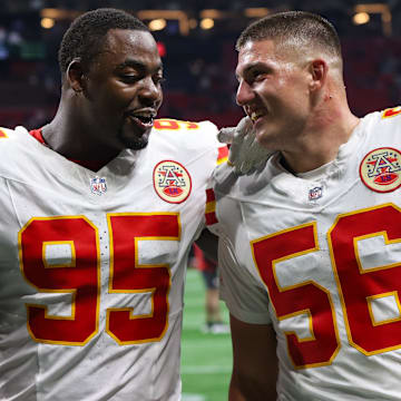 Kansas City Chiefs defensive tackle Chris Jones (95) and defensive end George Karlaftis (56) talk after a victory over the Atlanta Falcons at Mercedes-Benz Stadium.