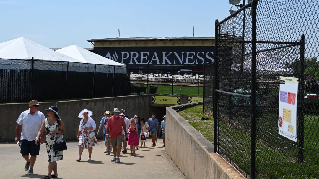 May 21, 2022; Baltimore, MD, USA;  Preakness attendees enter the infield via a tunnel at Pimlico