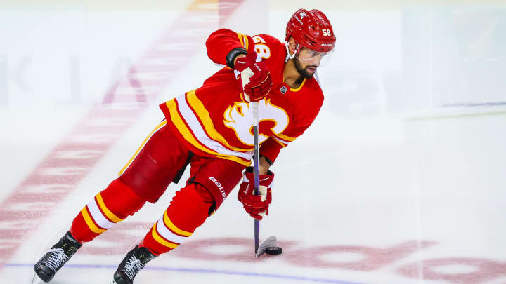 Apr 18, 2024; Calgary, Alberta, CAN; Calgary Flames defenseman Oliver Kylington (58) skates with the puck during the warmup period against the San Jose Sharks at Scotiabank Saddledome. Mandatory Credit: Sergei Belski-USA TODAY Sports