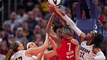 Indiana Fever forward Aliyah Boston (7) goes in for a lay-up against Atlanta Dream forward Cheyenne Parker-Tyus (32) and Atlanta Dream guard Haley Jones (13) on Thursday, June 13, 2024, during the game at Gainbridge Fieldhouse in Indianapolis. The Indiana Fever defeated the Atlanta Dream, 91-84.