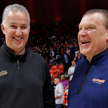 Mar 5, 2024; Champaign, Illinois, USA; Purdue Boilermakers head coach Matt Painter and Illinois Fighting Illini head coach Brad Underwood chat before the start of the game at State Farm Center. Mandatory Credit: Ron Johnson-Imagn Images