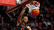 Jan 13, 2024; Blacksburg, Virginia, USA; Miami Hurricanes guard Matthew Cleveland (0) dunks the ball against Virginia Tech Hokies guard Tyler Nickel (23) during the first half at Cassell Coliseum. Mandatory Credit: Peter Casey-Imagn Images