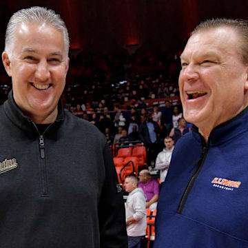 Mar 5, 2024; Champaign, Illinois, USA; Purdue Boilermakers head coach Matt Painter and Illinois Fighting Illini head coach Brad Underwood chat before the start of the game at State Farm Center. Mandatory Credit: Ron Johnson-Imagn Images