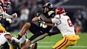Purdue Boilermakers running back Devin Mockobee (45) is tackled 