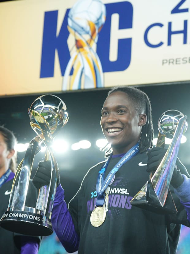 Orlando Pride forward Barbra Banda (22) celebrates with the NWSL championship and MVP trophies